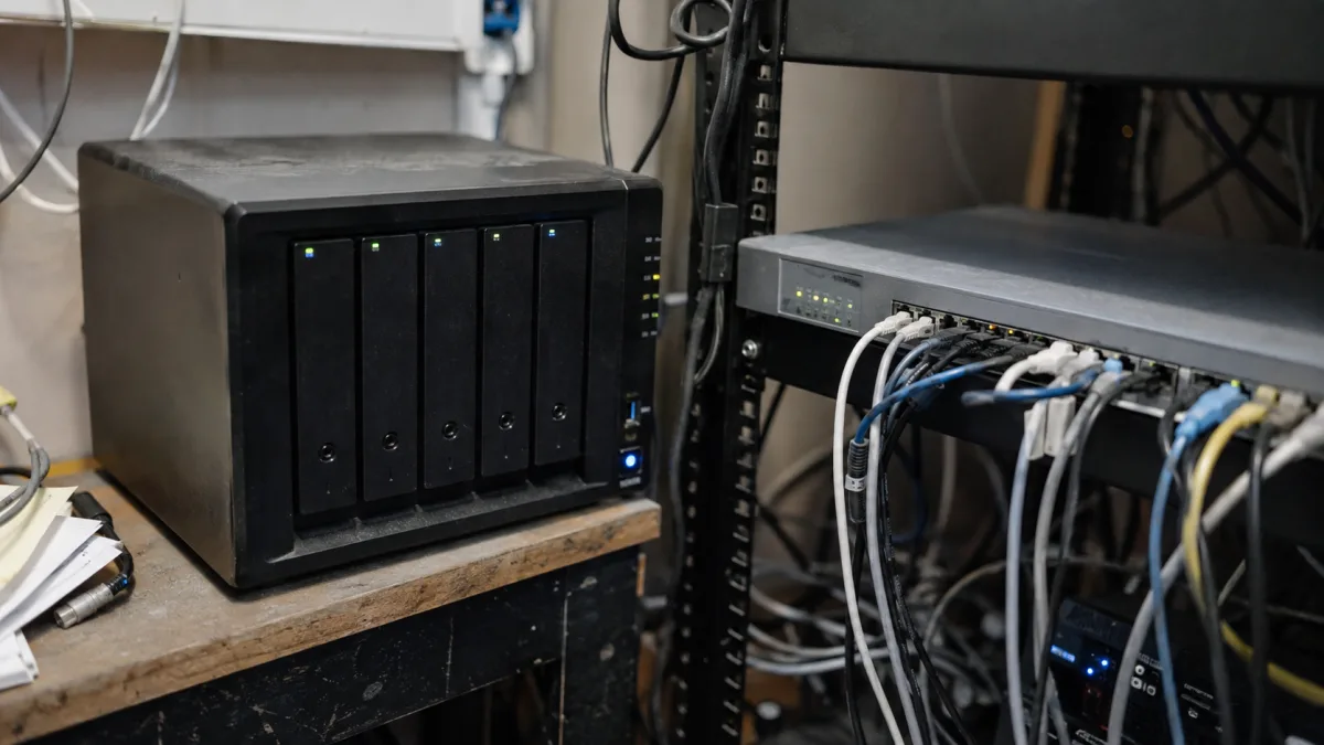 NAS backup device and network firewall representing layered ransomware defenses in a Montreal small business